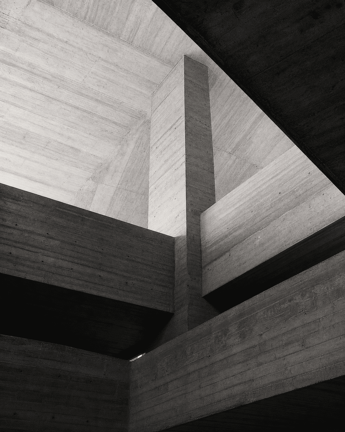 Brutalist concrete structure photographed from below